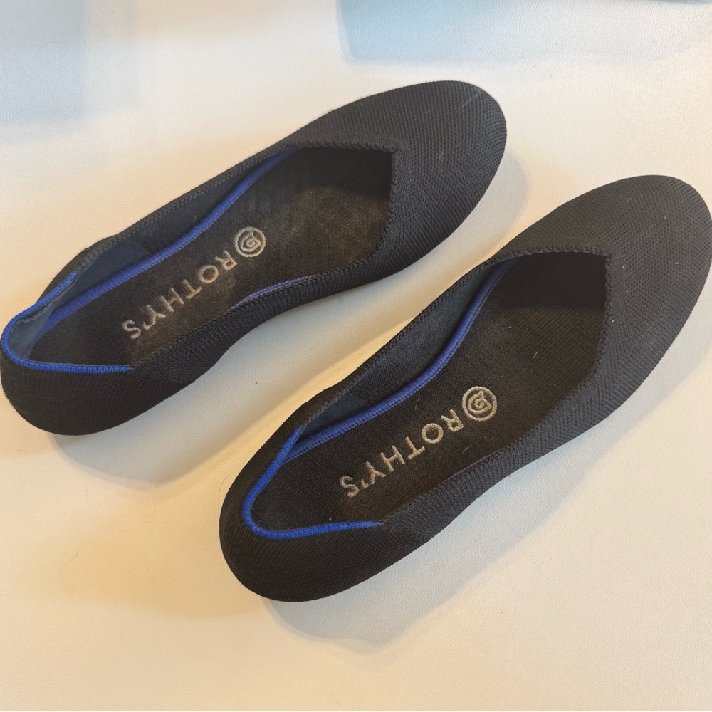 Rothy's Elegant Black Flats with Blue Accent